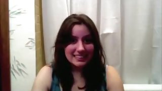 Chubby girl fucks a cucumber on the bathroom floor