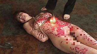 Kinky Asian slavegirl gets drenched in molten wax