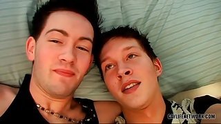 Hot young guys look sexy kissing in bed